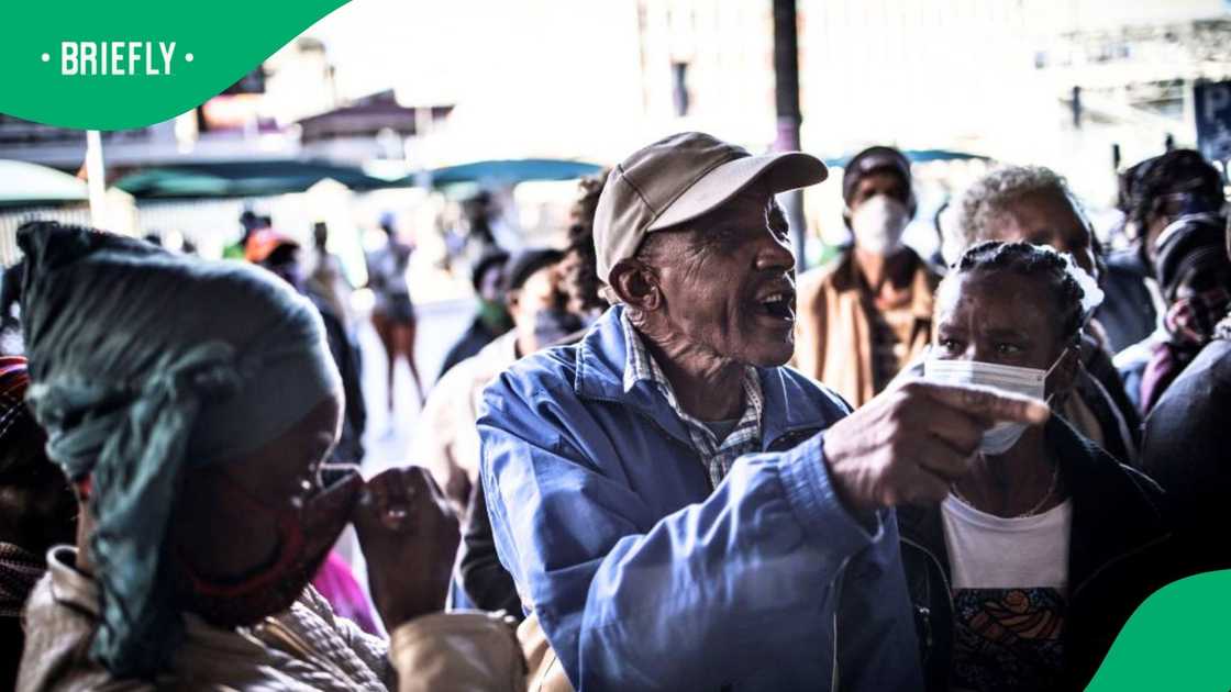 Disgruntled recipients vent their anger after they've queued from early morning in Johannesburg, on May 4, 2020 to receive their South African Social Security Agency (SASSA) grants Disgruntled recipients vent their anger after they've queued from early morning in Johannesburg, on May 4, 2020 to receive their South African Social Security Agency (SASSA) grants