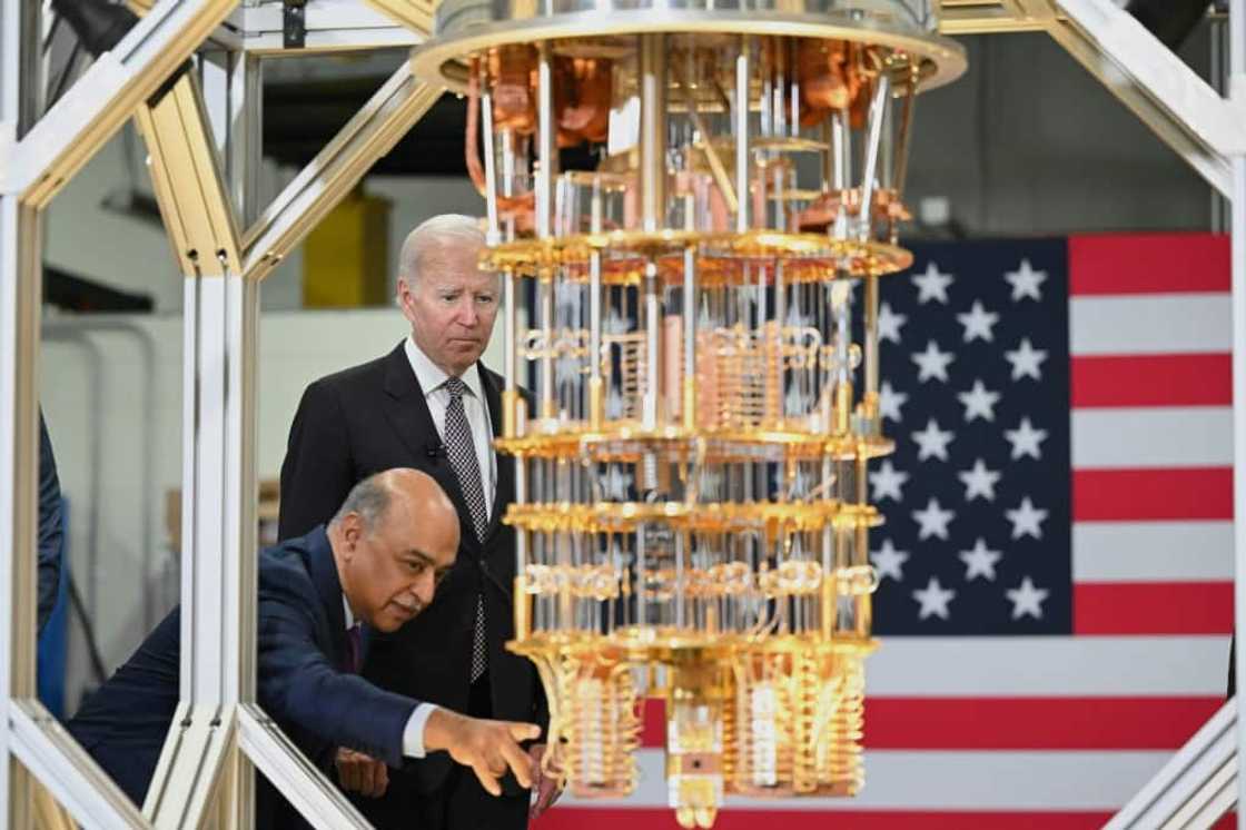 US President Joe Biden listens to IBM CEO Arvind Krishna as he tours the IBM facility in Poughkeepsie, New York US President Joe Biden listens to IBM CEO Arvind Krishna as he tours the IBM facility in Poughkeepsie, New York