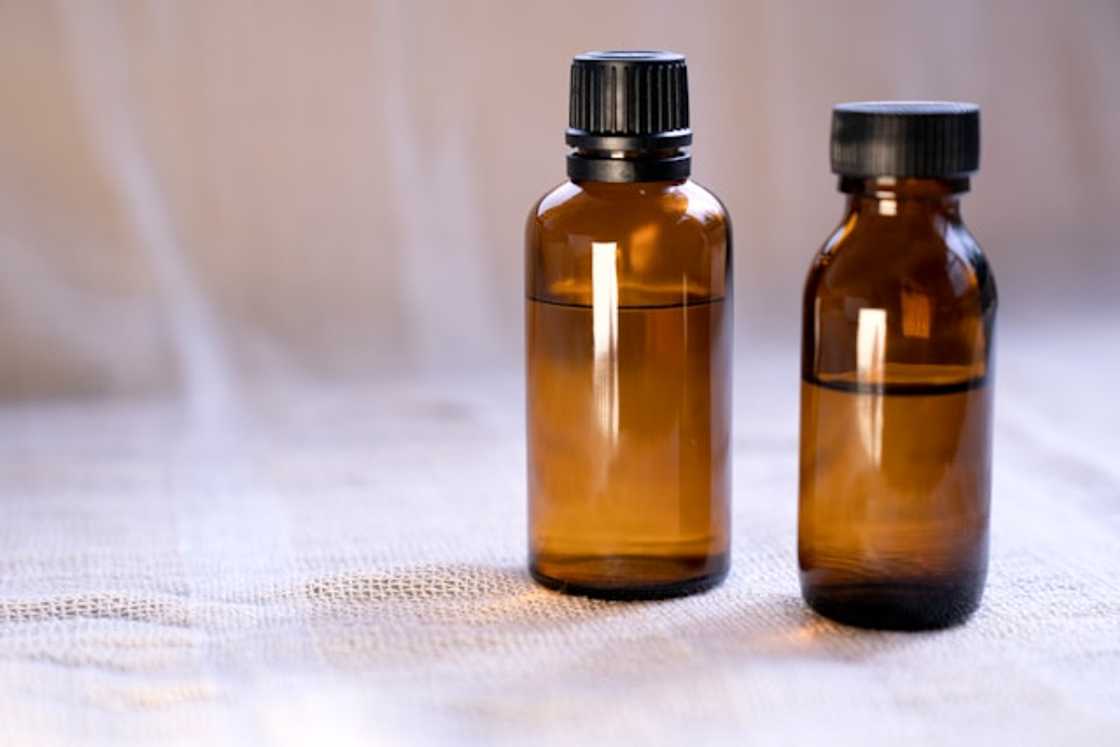 Two bottles of oil on a table Two bottles of oil on a table
