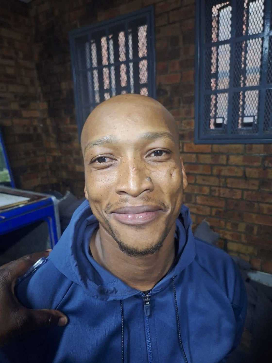 DJ Spitjo was seen smiling at the police station.