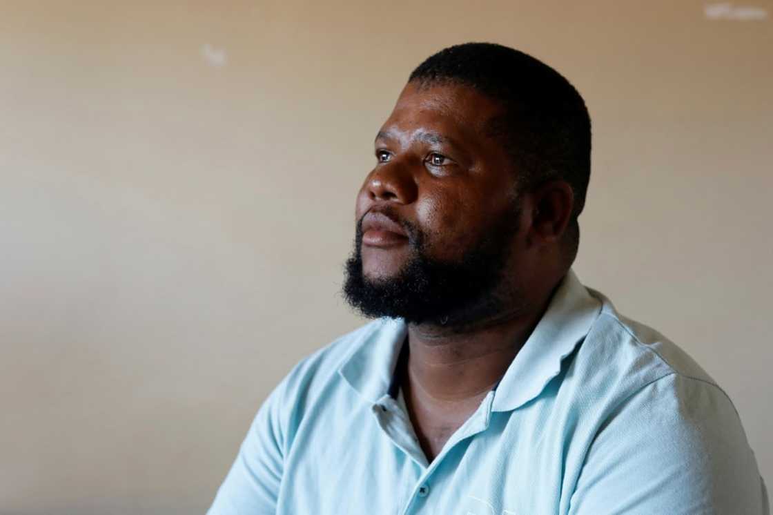 Mzoxolo Magidiwana, 34, was shot nine times but survived Mzoxolo Magidiwana, 34, was shot nine times but survived