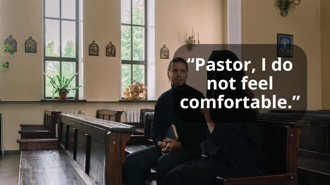 A man and a woman dressed sitting together inside a church, holding prayer beads and a book.