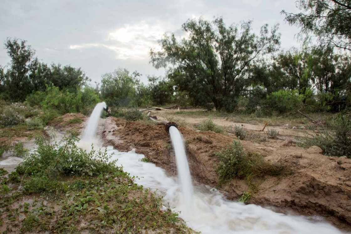 Water is pumped out of a coal mine in northern Mexico where 10 workers are trapped