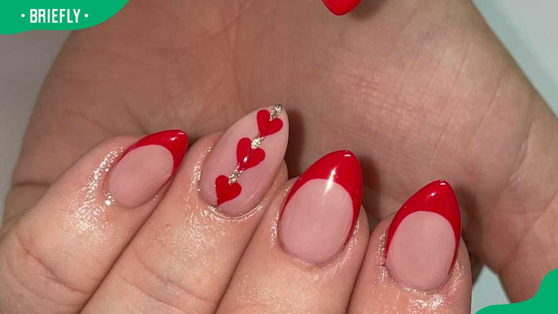 Red frenchie and hearts nail design