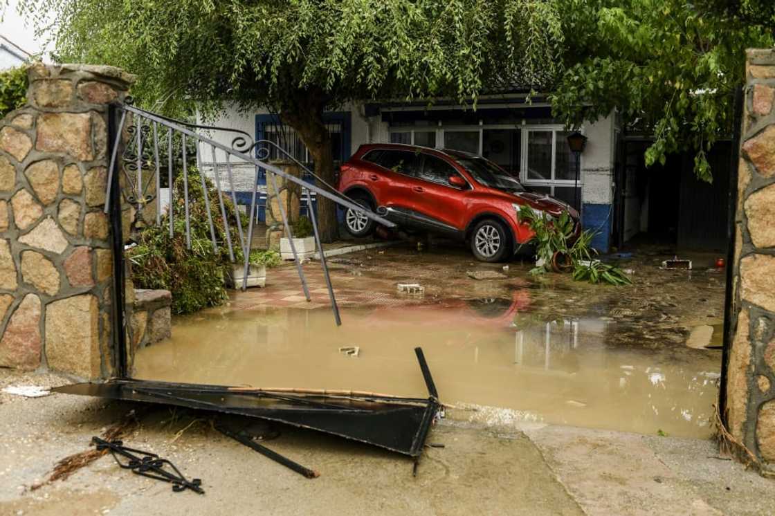 A car stranded in a garden in Aldea del Fresno, near Madrid