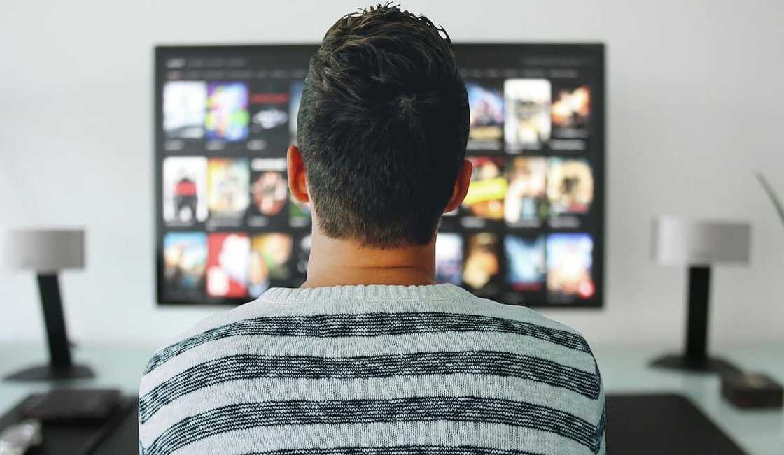 A man watching TV A man watching TV