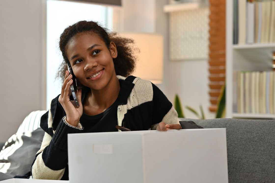 A happy woman making a call