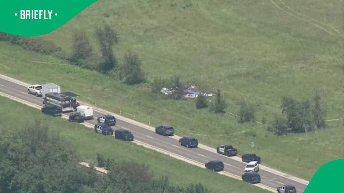 Numerous law enforcement and first responder trucks parked on the roadside near the site where a skydiving plane tragically crashed in Missouri Numerous law enforcement and first responder trucks parked on the roadside near the site where a skydiving plane tragically crashed in Missouri
