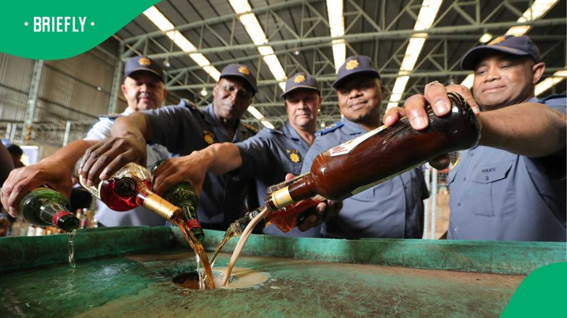 Western Cape Deputy Provincial Commissioners and Provincial Heads destroying confiscated liquor. Western Cape Deputy Provincial Commissioners and Provincial Heads destroying confiscated liquor.