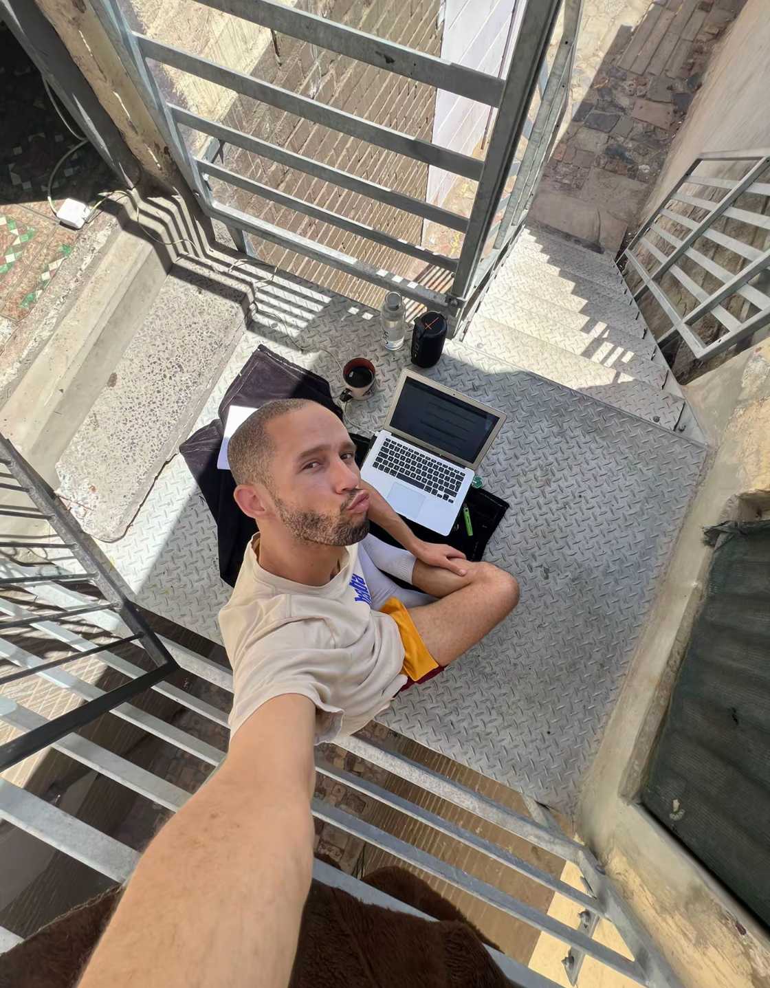 Darion Adams posing for a selfie with a laptop in front of him.
Image: @darion.adams Darion Adams posing for a selfie with a laptop in front of him.
Image: @darion.adams