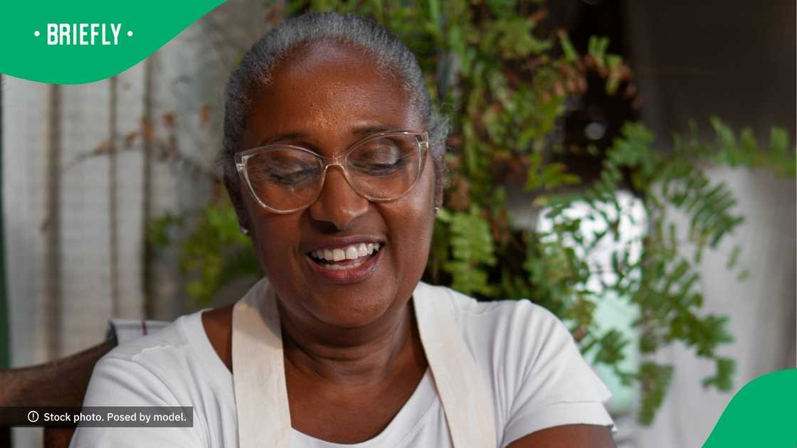 Woman shows stokvel packs with booze