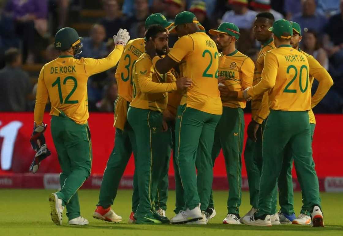 Well bowled - South Africa's Tabraiz Shamsi (C) is congratulated by teammates after his dismissal of England's Sam Curran