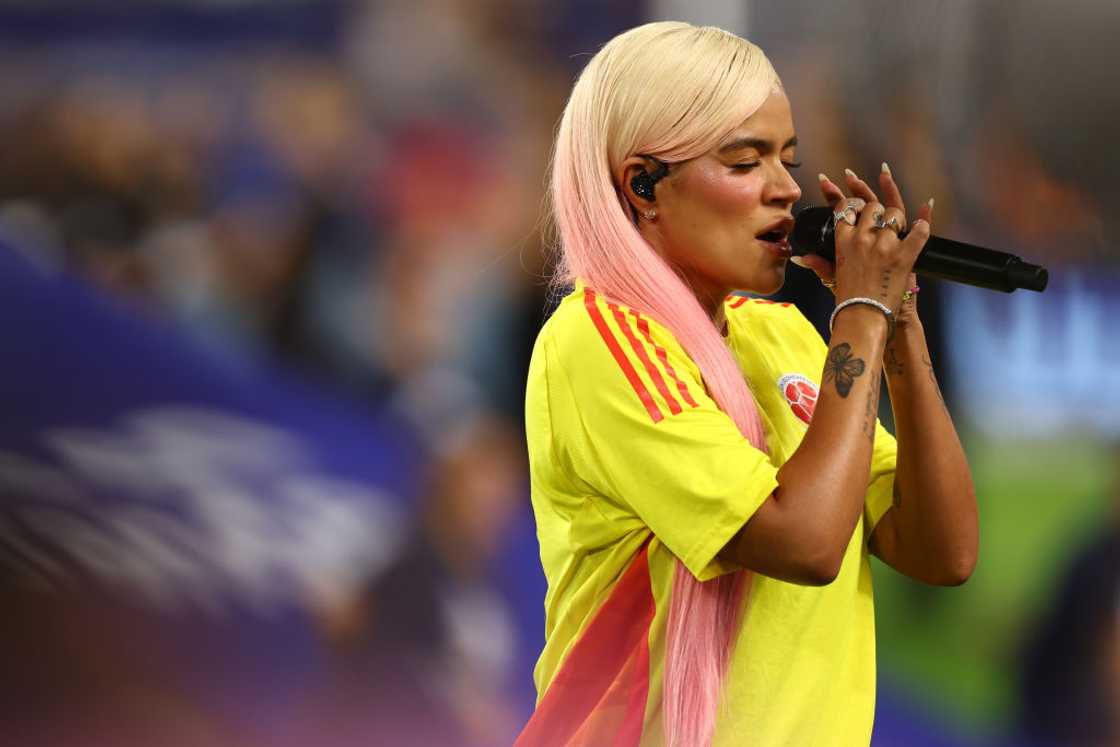 Karol G singing Colombia's national anthem