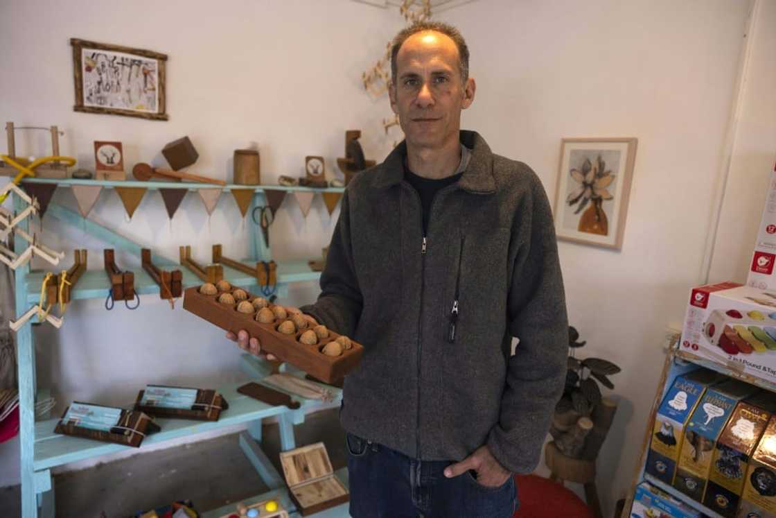 Standing in a former factory in Hanita, a kibbutz in Israel's north, Yuval Vakrat is surrounded by shops, an art gallery and a distillery