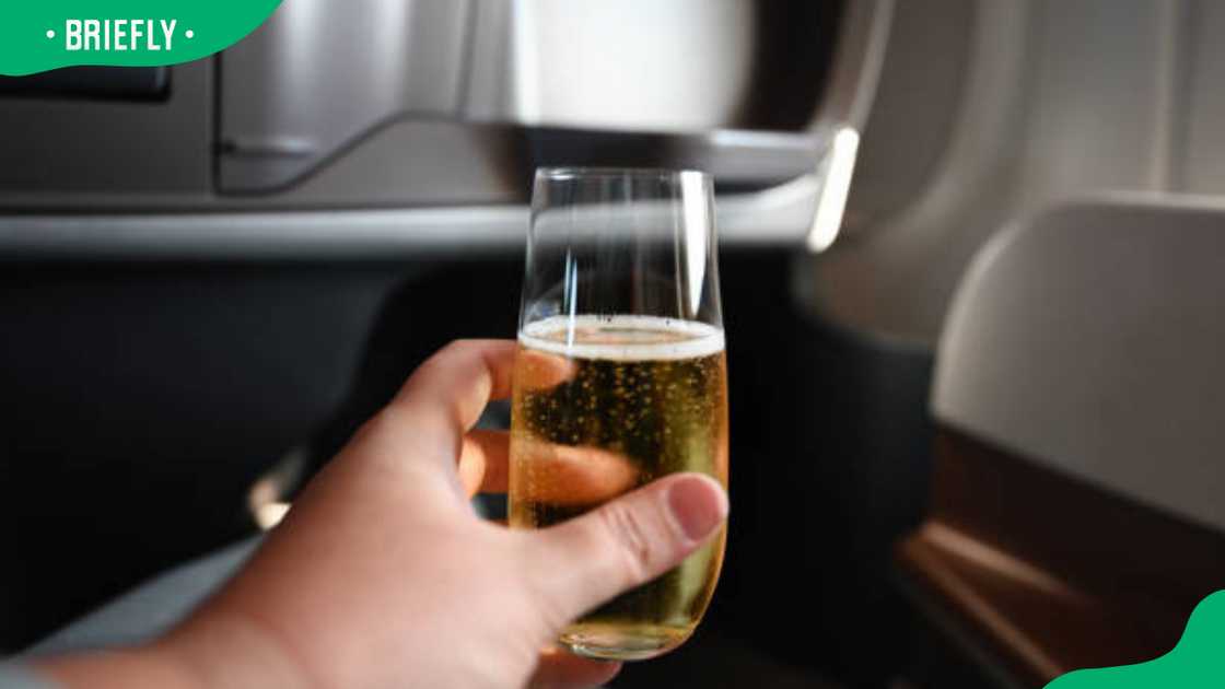A traveller taking champagne A traveller taking champagne