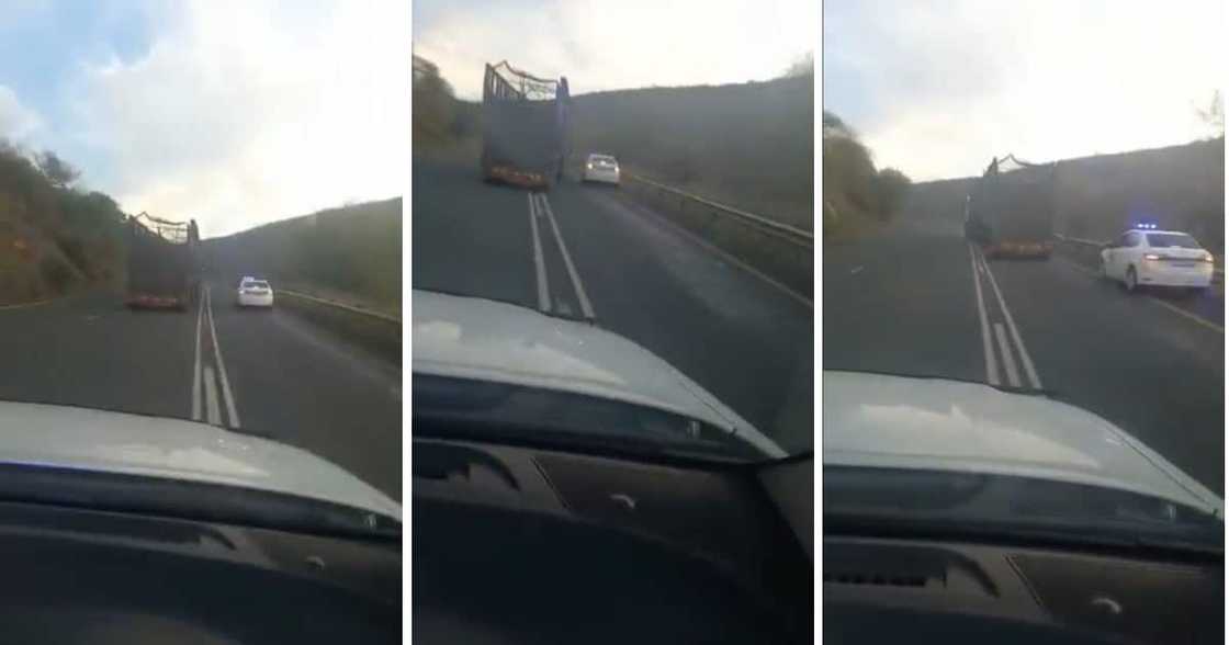A lorry nearly ran a car into a rail barrier. A lorry nearly ran a car into a rail barrier.