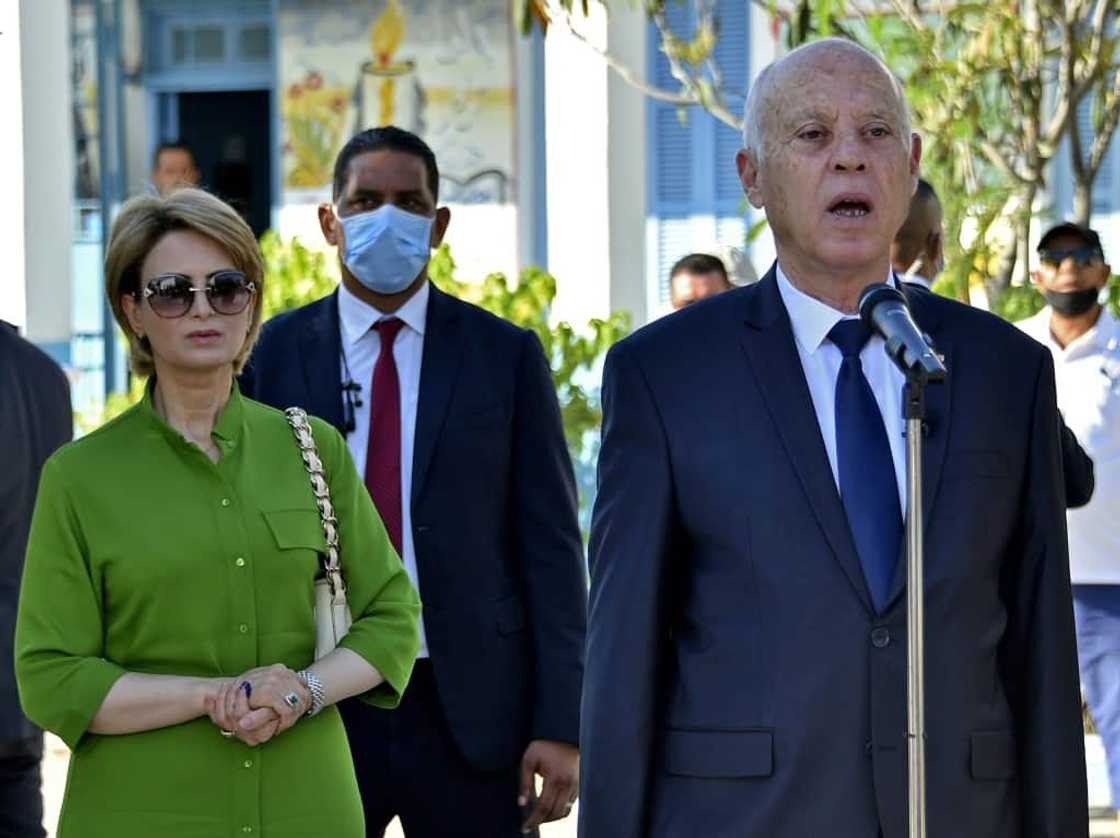 Tunisian President Kais Saied speaks after voting with his wife Ichraf Chebil Tunisian President Kais Saied speaks after voting with his wife Ichraf Chebil
