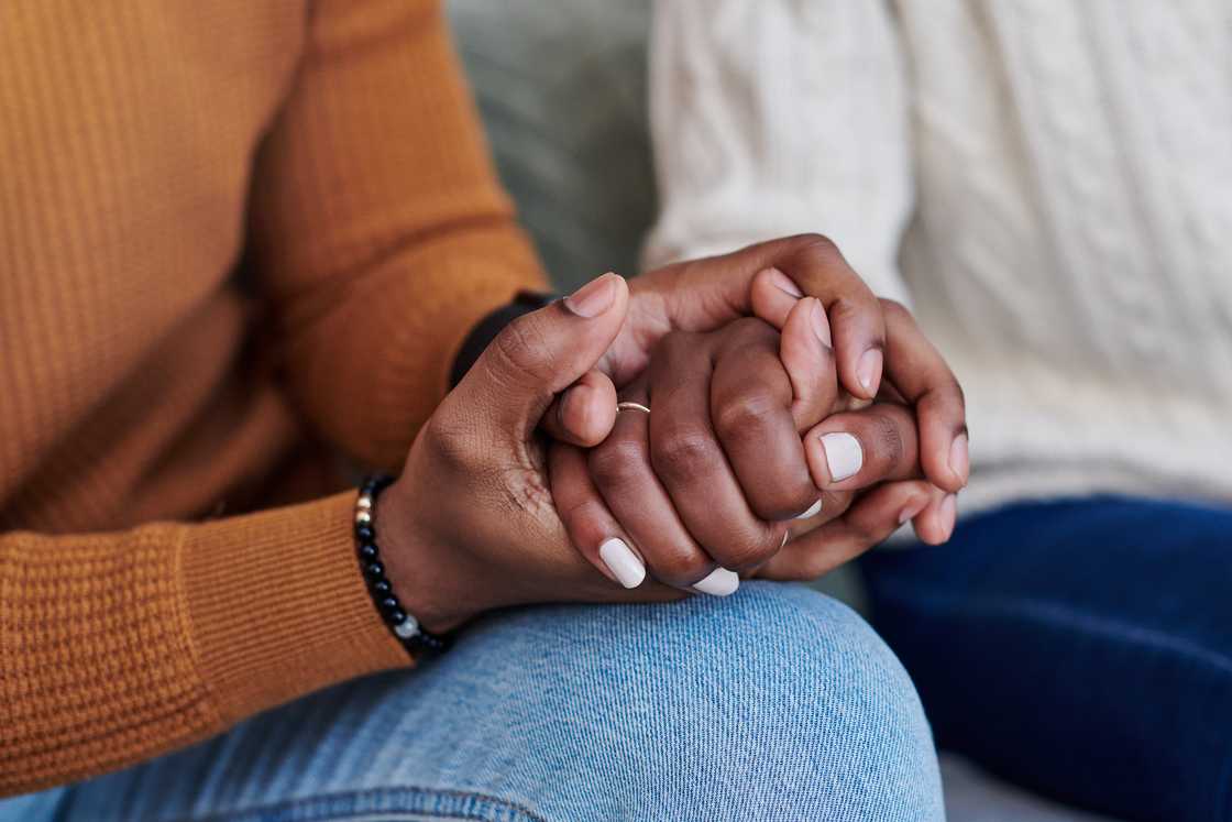 A couple holding hands