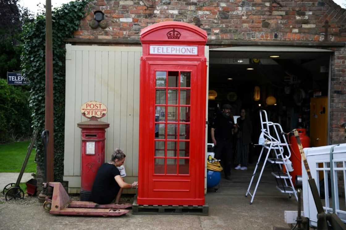 Redundant red phone boxes are increasingly being adopted by local communities and converted Redundant red phone boxes are increasingly being adopted by local communities and converted