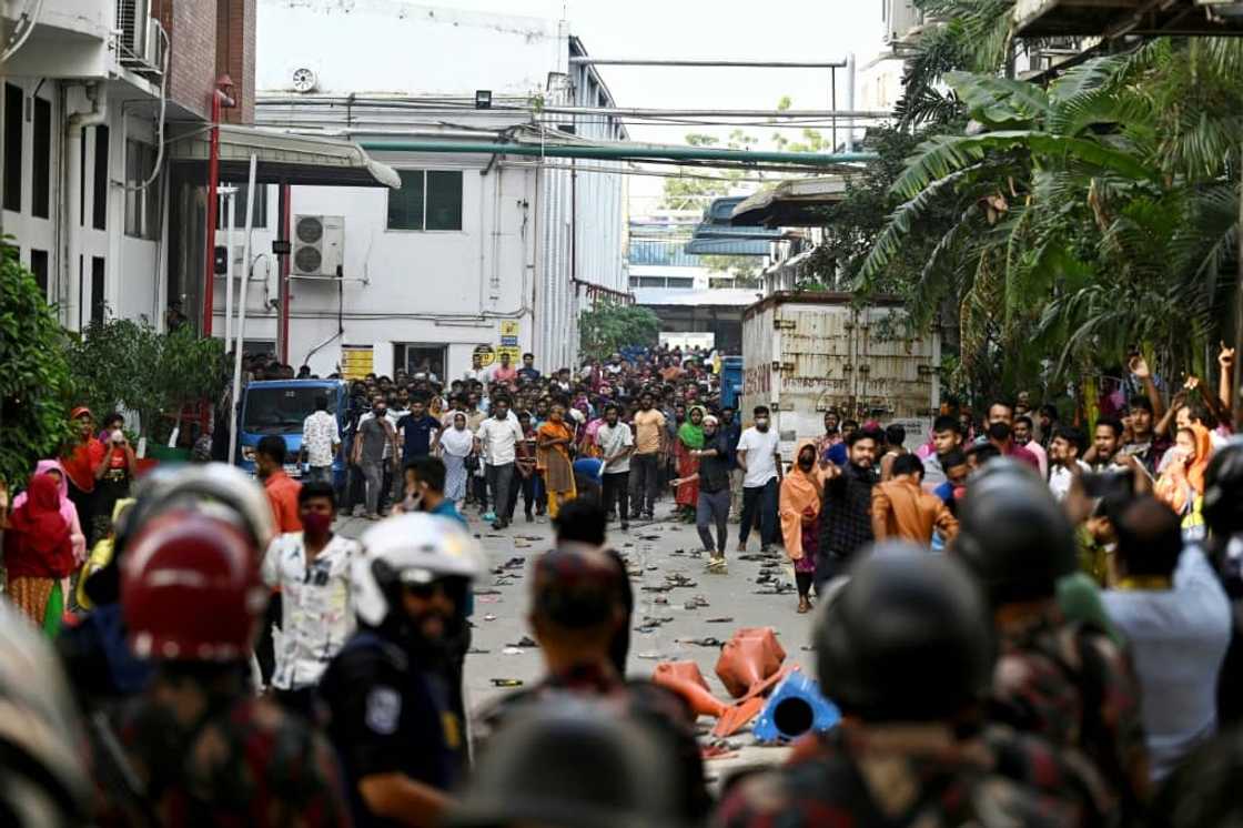 Garment workers clash with police during a rally in Gazipur on November 9. They are demanding a minimum wage of around $208 a month