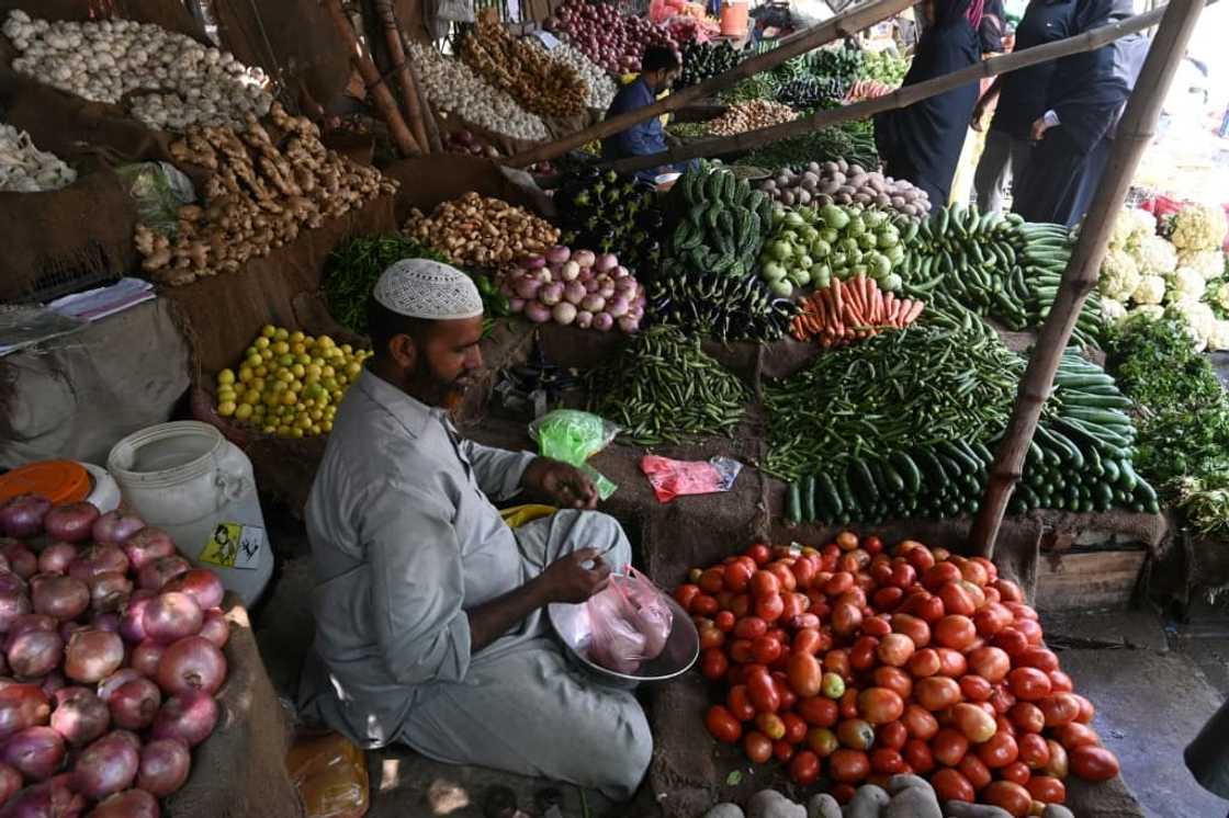 A vegetable vendor at his market stall in Lahore