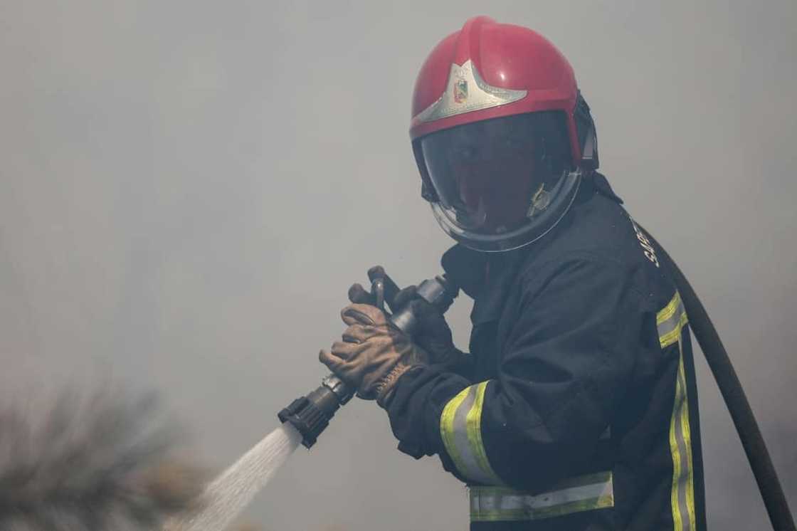 Firefighters will have to continue their work Monday in what one forecaster described as 'an apocalypse of heat'