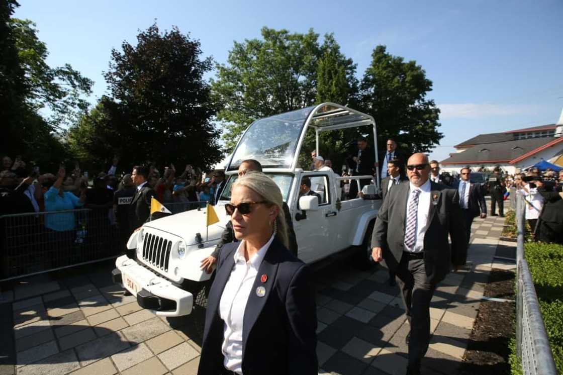 Pope Francis arrives at the shrine of Sainte-Anne-de-Beaupre in Quebec, Canada, and greets the crowd of thousands of people from his popemobile Pope Francis arrives at the shrine of Sainte-Anne-de-Beaupre in Quebec, Canada, and greets the crowd of thousands of people from his popemobile