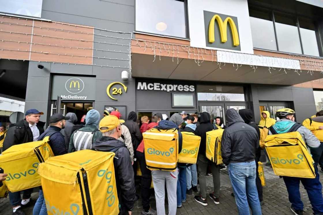 Delivery workers gather at a McDonald restaurant to pick up orders in Kyiv Delivery workers gather at a McDonald restaurant to pick up orders in Kyiv