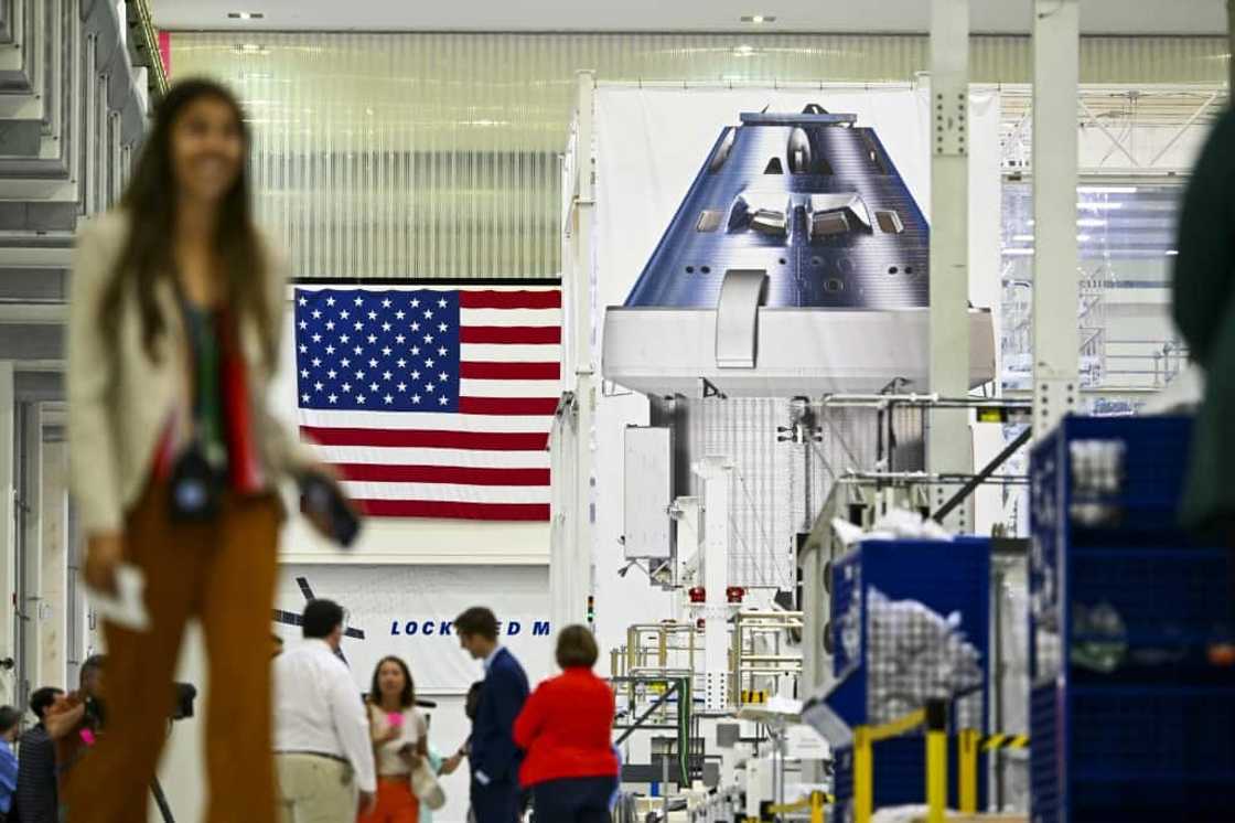 Officials and media personnel are seen inside the Operations and Checkout Building (O&C) at the Kennedy Space Center in Cape Canaveral, Florida Officials and media personnel are seen inside the Operations and Checkout Building (O&C) at the Kennedy Space Center in Cape Canaveral, Florida