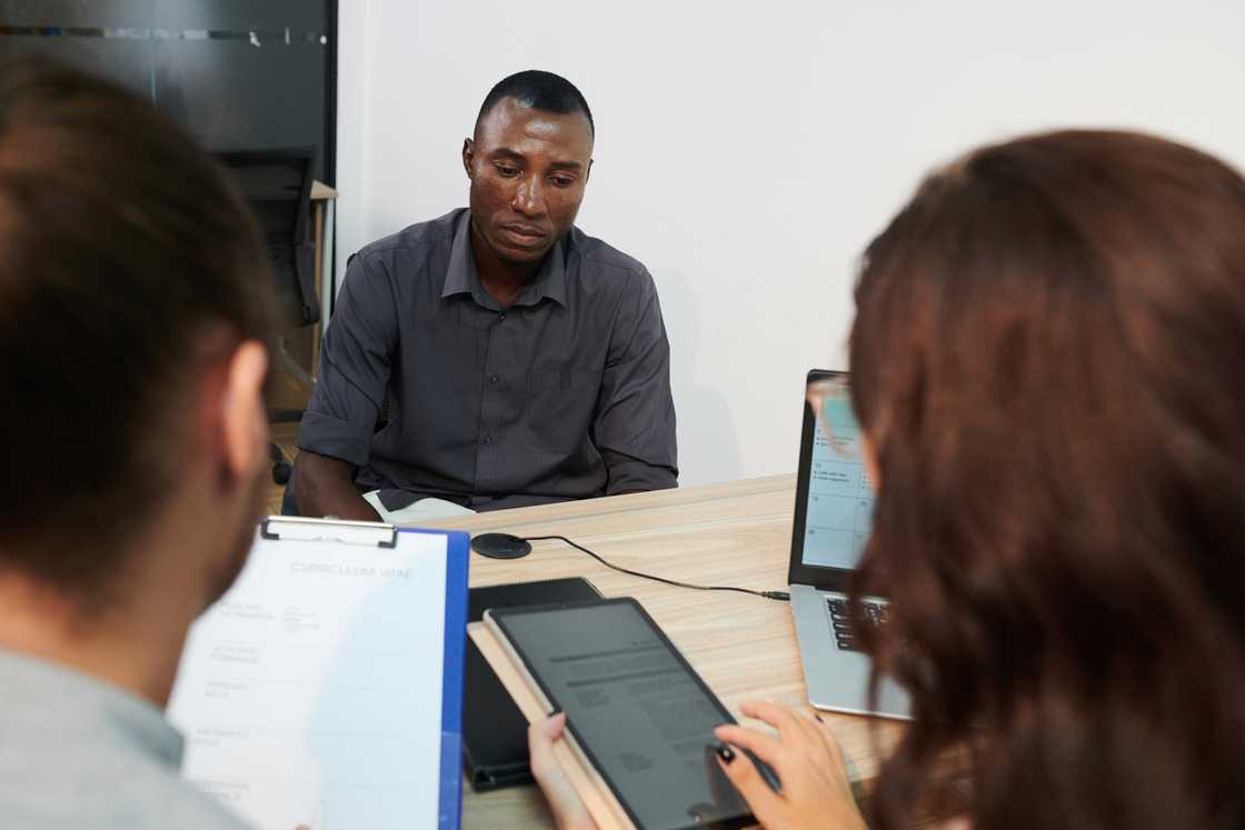 A tense employee in a meeting