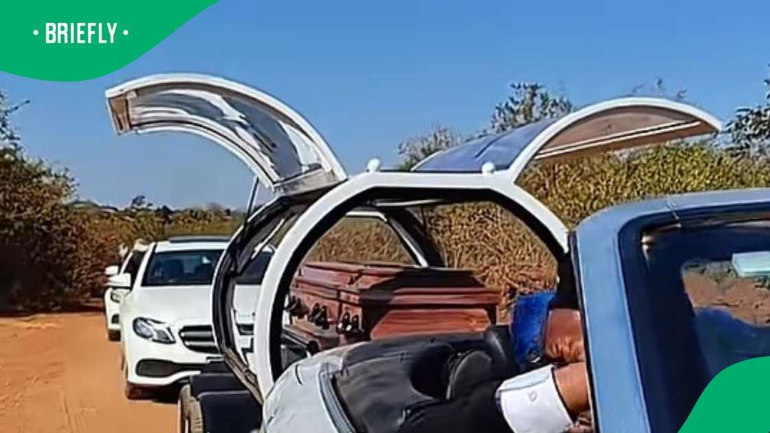 Coffin transported in butterfly hearse Coffin transported in butterfly hearse