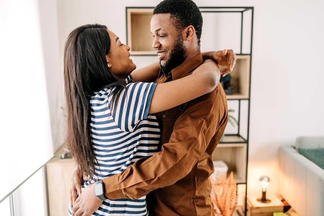 A man and woman hugging