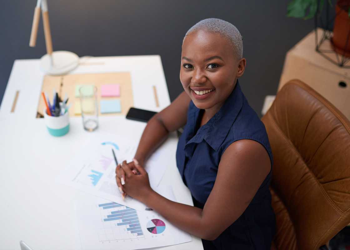 A young woman sitting in office.