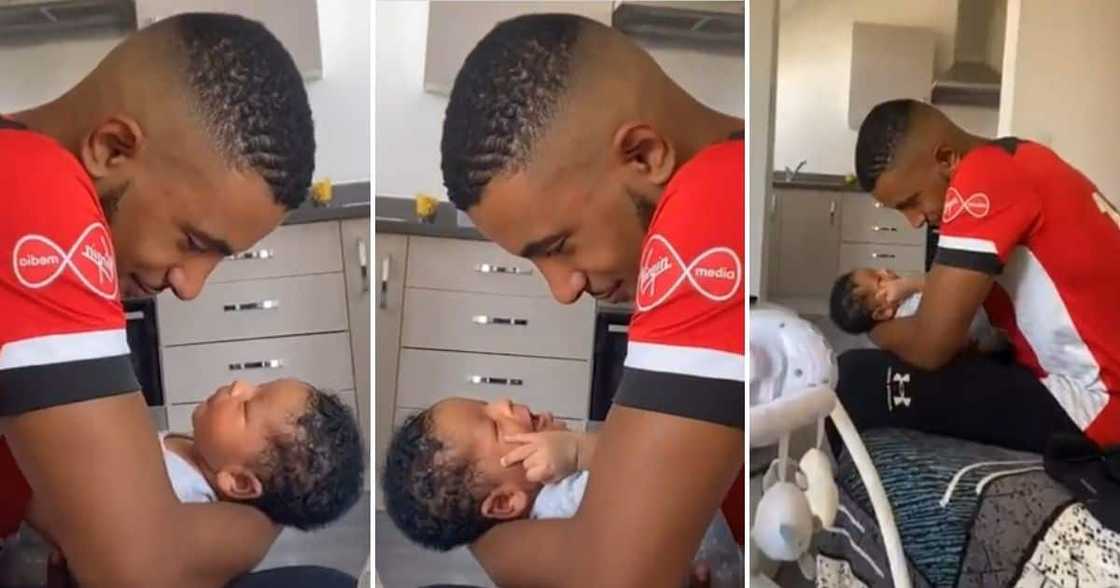 A man looked at his newborn baby intensely. A man looked at his newborn baby intensely.