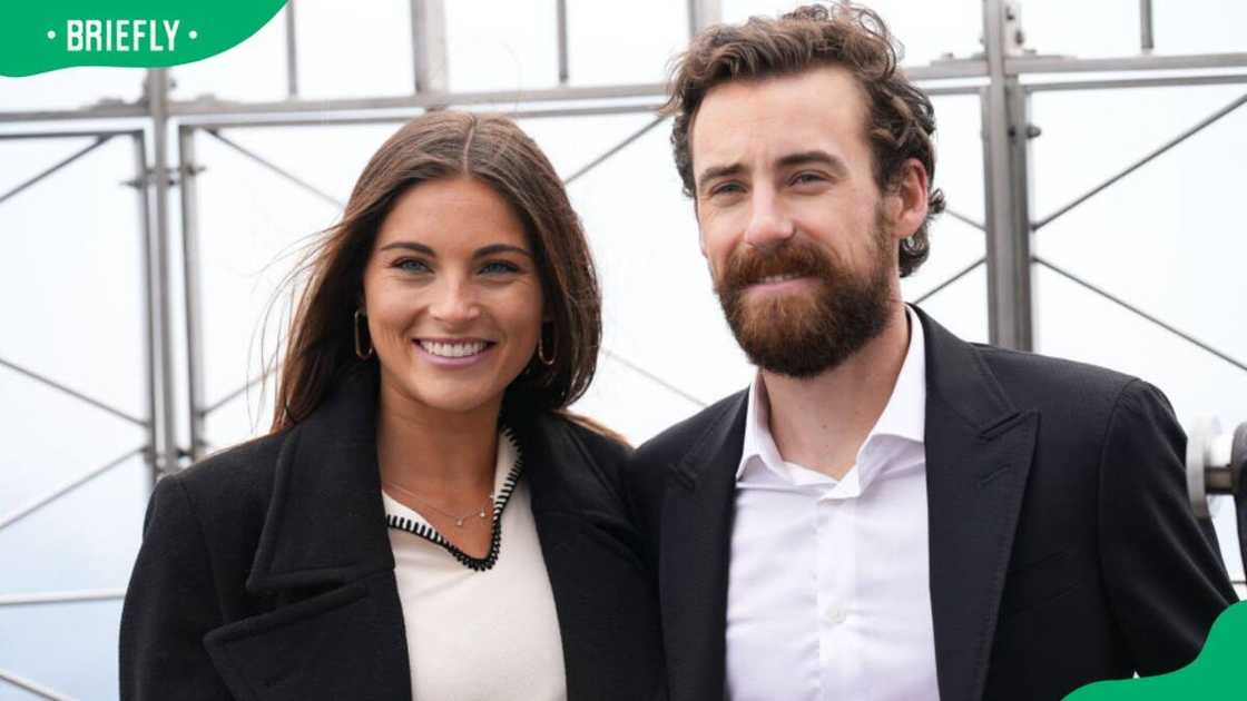 Gianna Tulio and Ryan Blaney posing for a photo at the Empire State Building in 2023