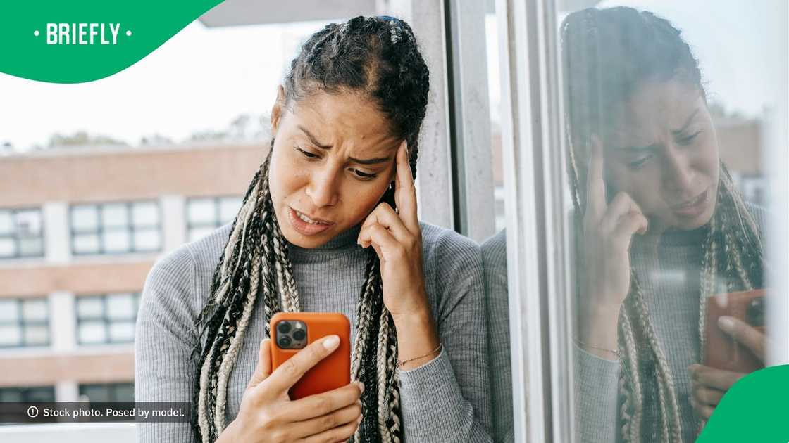 The boat remained trapped on the edge of the dam wall after the four occupants were pulled to safety