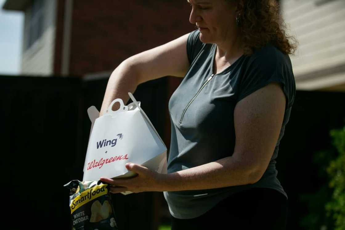 Wing customers are able to place orders through a mobile app, while drones can delivery up to six miles from a Wing facility Wing customers are able to place orders through a mobile app, while drones can delivery up to six miles from a Wing facility
