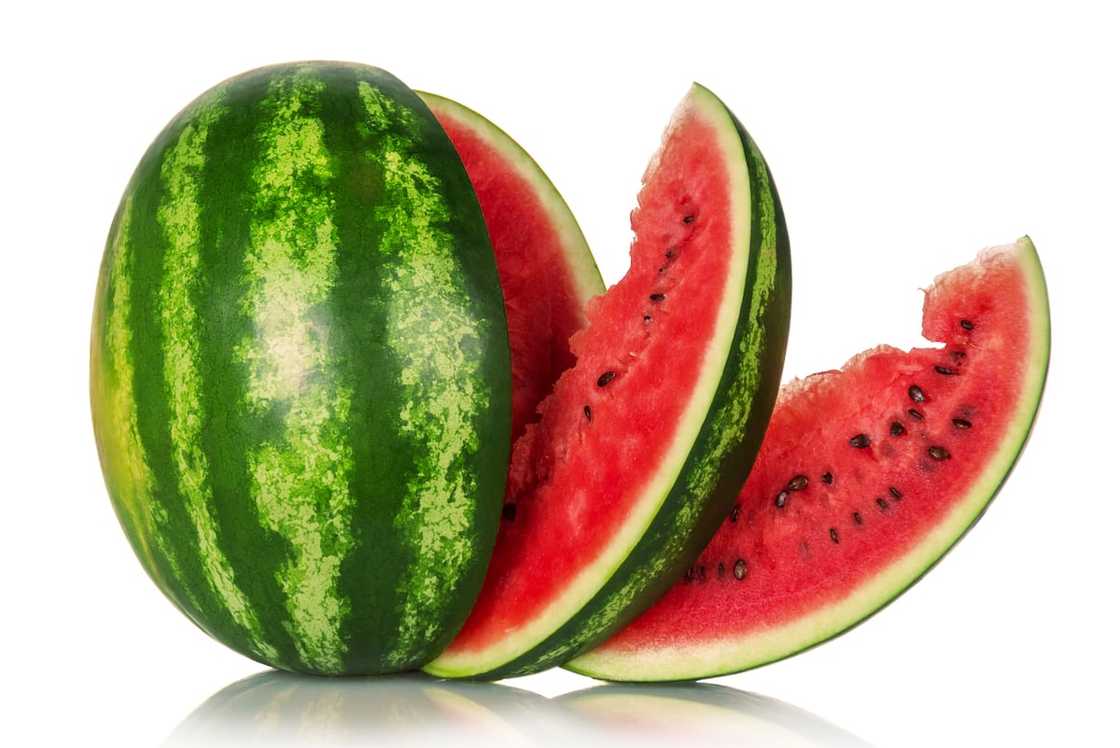 Watermelon and several slices isolated on white background. Watermelon and several slices isolated on white background.