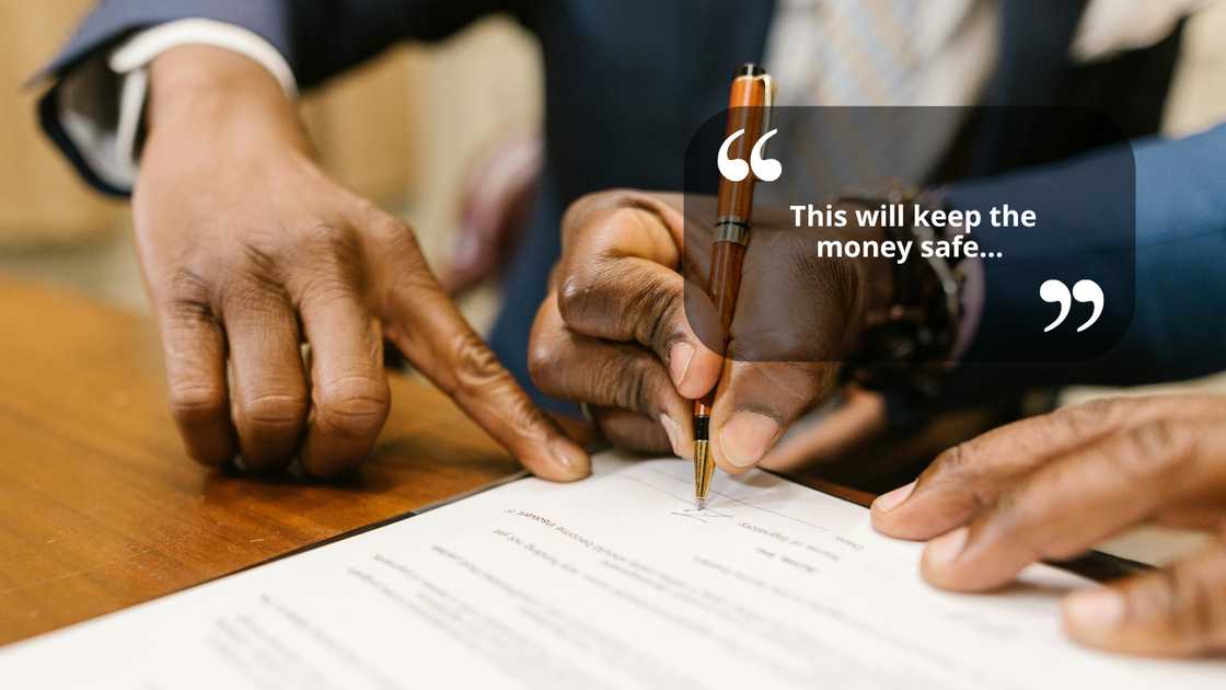A man signing documents A man signing documents