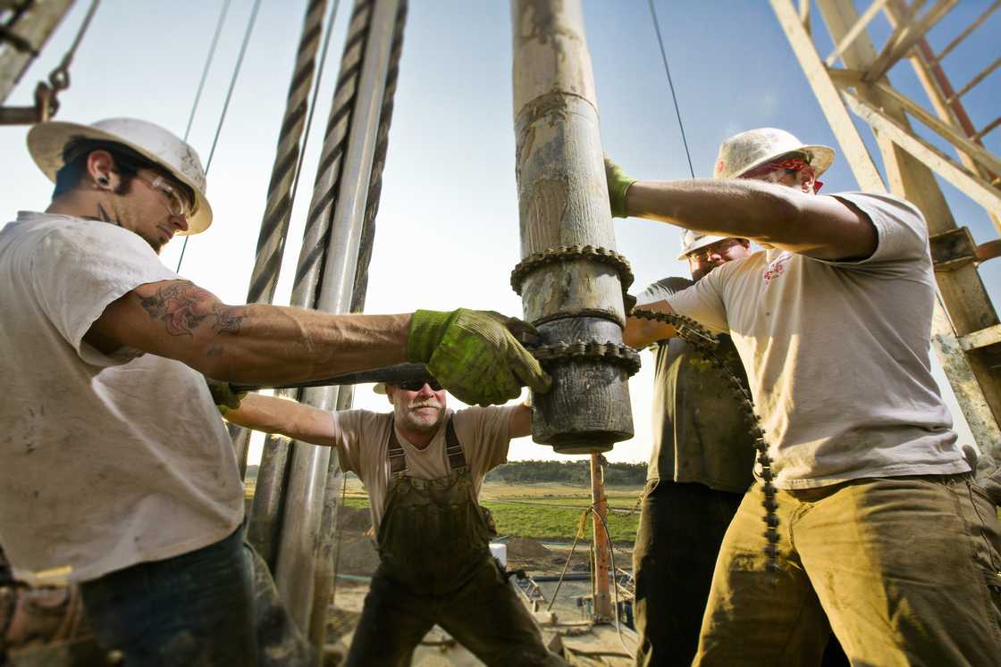 Oil rig workers on the drilling site Oil rig workers on the drilling site