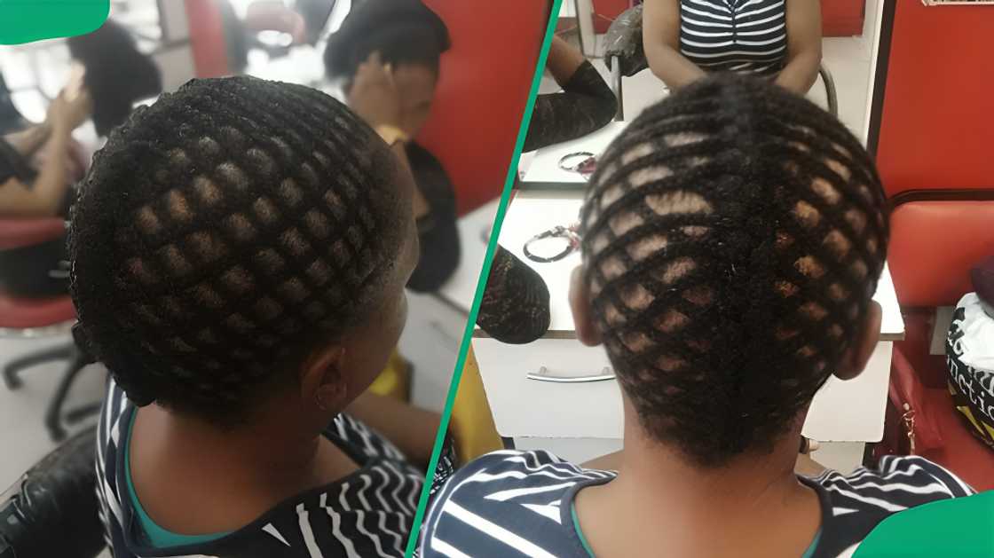A lady with criss-crossed cornrows A lady with criss-crossed cornrows
