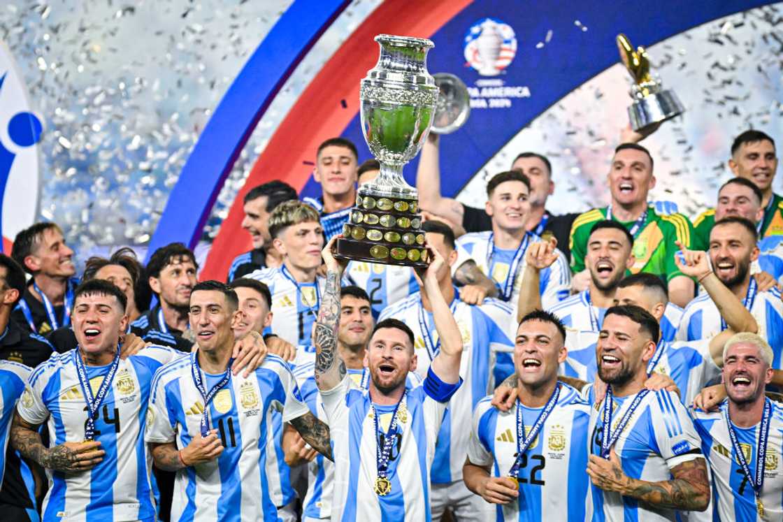 Lionel Messi lifts the Copa America trophy.