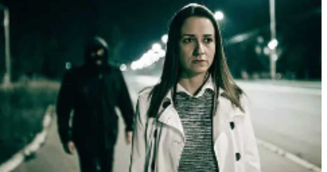Woman being followed by robber Woman being followed by robber