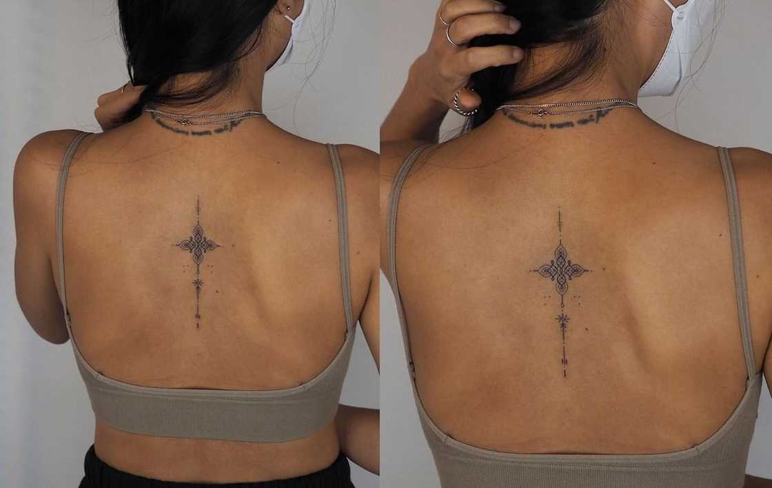 Dainty spine tattoo