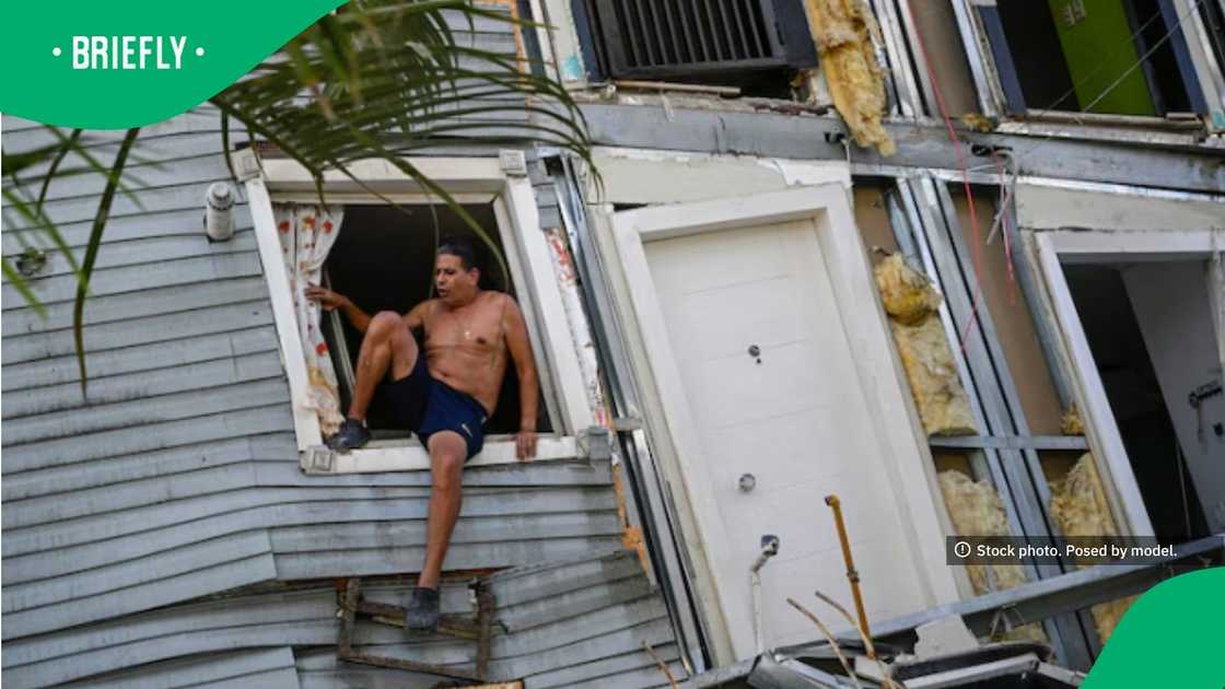 The image captured a resident evacuating a distorted structure where the walls and doorways were visibly shifted off-center.