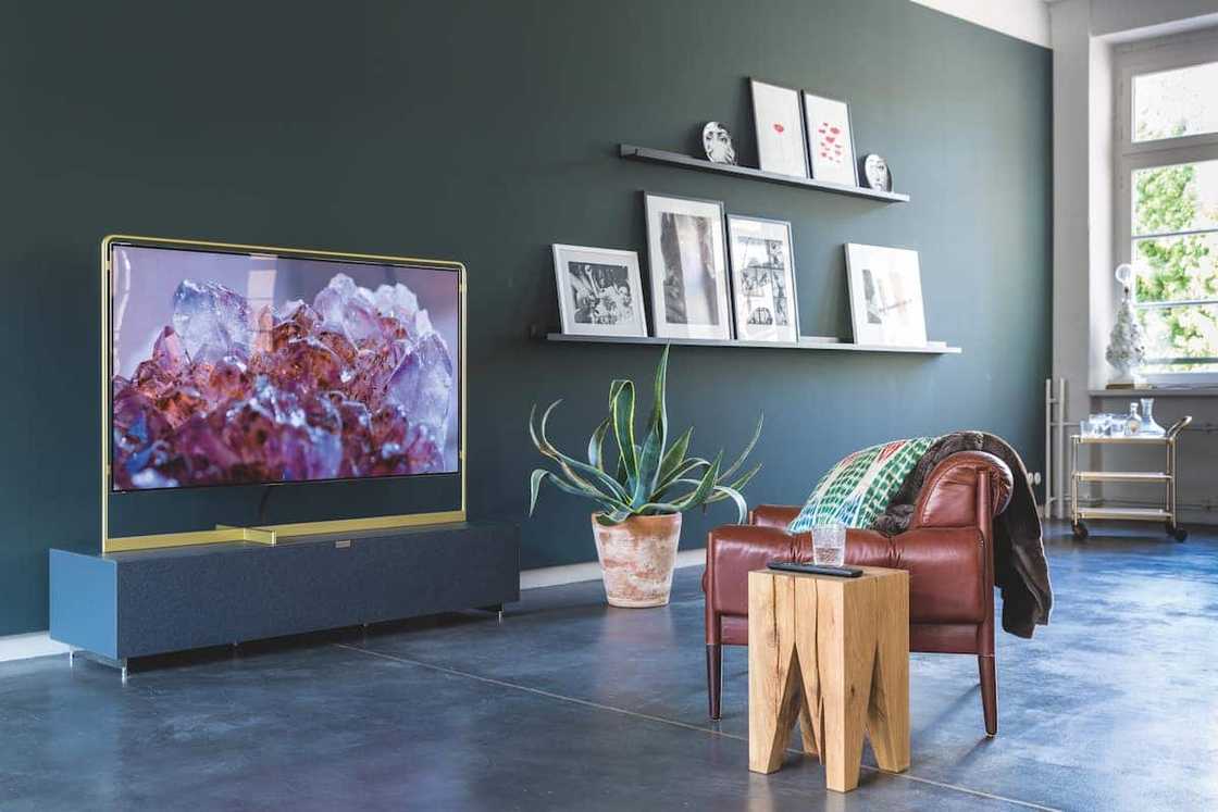 A television screen on a stand A television screen on a stand