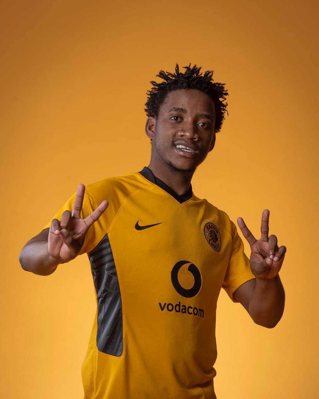 Former Kaizer Chiefs Player Lebohang Lesako in his old team's colours and his new jersey Former Kaizer Chiefs Player Lebohang Lesako in his old team's colours and his new jersey