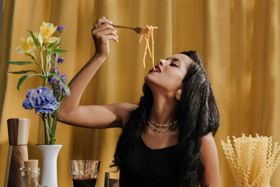 A woman eating spaghetti