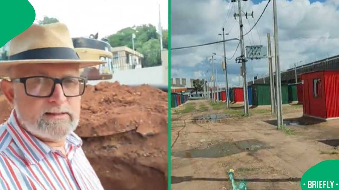 A row of small, brightly coloured corrugated-iron structures in a dusty open field