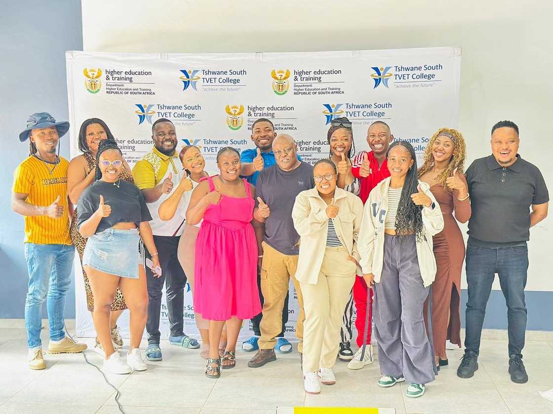 Tshwane South TVET College students standing in front of the institution's banner